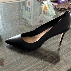 Brand new. Never worn black heels